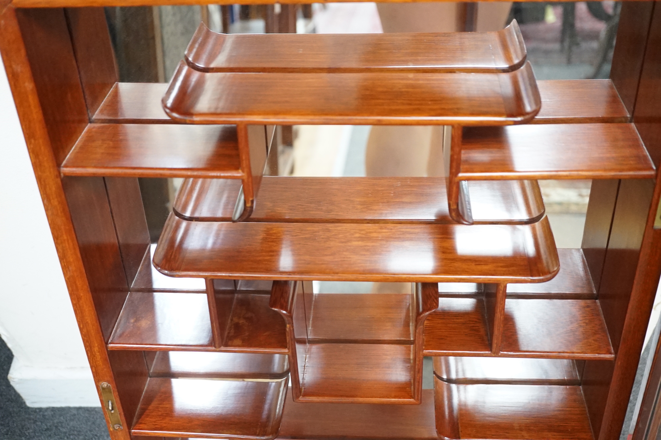 A Chinese hardwood snuff bottle display cabinet, width 46cm, depth 10cm, height 76cm